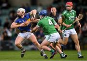 24 October 2021; Cian Lynch of Patrickswell is tackled by Kilmallock players Dan Joy, 4, and Aaron Costello, hidden, during the Limerick County Senior Club Hurling Championship Final match between Kilmallock and Patrickswell at TUS Gaelic Grounds in Limerick. Photo by Piaras Ó Mídheach/Sportsfile