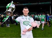 24 October 2021; Kilmallock goalkeeper Barry Hennessy celebrates with the cup as he holds his sleeping daughter Hope, age 3 months, after the Limerick County Senior Club Hurling Championship Final match between Kilmallock and Patrickswell at TUS Gaelic Grounds in Limerick. Photo by Piaras Ó Mídheach/Sportsfile