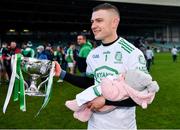24 October 2021; Kilmallock goalkeeper Barry Hennessy celebrates with the cup as he holds his sleeping daughter Hope, age 3 months, after the Limerick County Senior Club Hurling Championship Final match between Kilmallock and Patrickswell at TUS Gaelic Grounds in Limerick. Photo by Piaras Ó Mídheach/Sportsfile