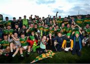 24 October 2021; Tourlestrane players and supporters celebrate with the cup after the Sligo County Senior Club Football Championship Final match between Tourlestrane and Coolera Strandhill at Markievicz Park in Sligo. Photo by David Fitzgerald/Sportsfile