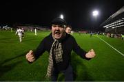 22 October 2021; A Bohemians supporter celebrates following the Extra.ie FAI Cup Semi-Final match between Bohemians and Waterford at Dalymount Park in Dublin. Photo by Stephen McCarthy/Sportsfile