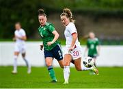 23 October 2021; Olivia McLoughlin of England in action against Tierna Bell of Northern Ireland during the UEFA Women's U19 Championship Qualifier match between England and Northern Ireland at Jackman Park in Limerick. Photo by Eóin Noonan/Sportsfile