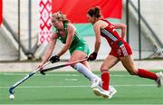 24 October 2021; Sarah Hawkshaw of Ireland in action against Leah Wilkinson of Wales during the FIH Women's World Cup European Qualifier Final match between Ireland and Wales at Pisa in Italy. Photo by Roberto Bregani/Sportsfile