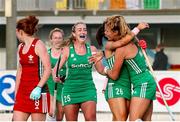 24 October 2021; Anna O'Flanagan of Ireland is congratulated by her team-mates Zara Malseed, right, and Sarah Hawkshaw, centre, after scoring her side's second goal during the FIH Women's World Cup European Qualifier Final match between Ireland and Wales at Pisa in Italy. Photo by Roberto Bregani/Sportsfile