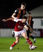 25 October 2021; Robbie Benson of St Patrick's Athletic is tackled by Daniel Kelly of Dundalk during the SSE Airtricity League Premier Division match between St Patrick's Athletic and Dundalk at Richmond Park in Dublin. Photo by Ben McShane/Sportsfile