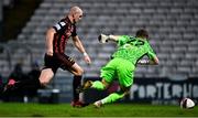 25 October 2021; Georgie Kelly of Bohemians rounds Waterford goalkeeper Paul Martin on his way to scoring his side's first goal during the SSE Airtricity League Premier Division match between Bohemians and Waterford at Dalymount Park in Dublin. Photo by Seb Daly/Sportsfile