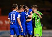 25 October 2021; Anthony Wordsworth of Waterford, centre, celebrates with team-mates, from left, Jack Stafford, Cameron Evans, and goalkeeper Paul Martin after their side's victory in the SSE Airtricity League Premier Division match between Bohemians and Waterford at Dalymount Park in Dublin. Photo by Seb Daly/Sportsfile