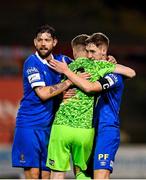 25 October 2021; Waterford players, from left, Anthony Wordsworth, goalkeeper Paul Martin and John Martin celebrate after their side's victory in the SSE Airtricity League Premier Division match between Bohemians and Waterford at Dalymount Park in Dublin. Photo by Seb Daly/Sportsfile