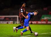 25 October 2021; Darragh Power of Waterford is fouled by Promise Omochere of Bohemians during the SSE Airtricity League Premier Division match between Bohemians and Waterford at Dalymount Park in Dublin. Photo by Seb Daly/Sportsfile