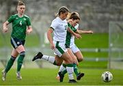 26 October 2021; Jenna Slattery of Republic of Ireland is tackled by Sarah Jane McMaster of Northern Ireland during the UEFA Women's U19 Championship Qualifier Group 5 Qualifying Round 1 League A match between Northern Ireland and Republic of Ireland at Jackman Park in Markets Field, Limerick. Photo by Eóin Noonan/Sportsfile