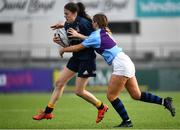 26 October 2021; Grace Adams of Metro is tackled by Robyn O'Connor of South East during the Sarah Robinson Cup First Round match between South East and Metro at Energia Park in Dublin. Photo by David Fitzgerald/Sportsfile