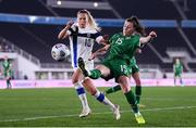 26 October 2021; Lucy Quinn of Republic of Ireland in action against Emmi Alanen of Finland during the FIFA Women's World Cup 2023 qualifying group A match between Finland and Republic of Ireland at Helsinki Olympic Stadium in Helsinki, Finland. Photo by Stephen McCarthy/Sportsfile