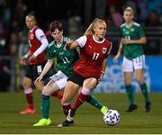 26 October 2021; Sarah Puntigam of Austria in action against Kirsty McGuinness of Northern Ireland during the FIFA Women's World Cup 2023 qualifying group D match between Northern Ireland and Austria at Seaview in Belfast. Photo by Ramsey Cardy/Sportsfile