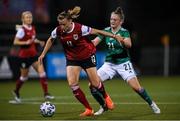 26 October 2021; Virginia Kirchberger of Austria in action against Kerry Beattie of Northern Ireland during the FIFA Women's World Cup 2023 qualifying group D match between Northern Ireland and Austria at Seaview in Belfast. Photo by Ramsey Cardy/Sportsfile