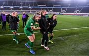26 October 2021; Aoibheann Clancy with Republic of Ireland team-mates Louise Quinn, left, and Lucy Quinn, right, following the FIFA Women's World Cup 2023 qualifying group A match between Finland and Republic of Ireland at Helsinki Olympic Stadium in Helsinki, Finland. Photo by Stephen McCarthy/Sportsfile