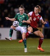 26 October 2021; Kerry Beattie of Northern Ireland in action against Virginia Kirchberger of Austria during the FIFA Women's World Cup 2023 qualifying group D match between Northern Ireland and Austria at Seaview in Belfast. Photo by Ramsey Cardy/Sportsfile