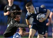 28 October 2021; PJ Larkin of North Midlands beats the tackle of Dylan Hewitt of Metro on the way to scoring his side's first try during the Shane Horgan Cup Third Round match between Metro and North Midlands at Energia Park in Dublin. Photo by Brendan Moran/Sportsfile