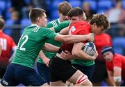 28 October 2021; Enda O’Brien of North East is tackled by Conor Fahy, left, and Tadhg Ronan of South East during the Shane Horgan Cup Third Round match between South East and North East at Energia Park in Dublin. Photo by Brendan Moran/Sportsfile