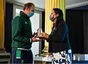 29 October 2021; The athletes and staff who represented Team Ireland at Tokyo 2020 this summer were formally congratulated at the Official Team Ireland Homecoming in Dublin Castle. A record number of Irish athletes competed at the Summer Olympics in Japan with 116 athletes competing across nineteen sports. An Taoiseach Michéal Martin TD, Minister Catherine Martin TD, Minister of State Jack Chambers TD and His Excellency Ambassador Extraordinary and Plenipotentiary of Japan to Ireland, Mr Mitsuru Kitano attended the event to honour the athletes. Making a presentation to Team Ireland support staff member Andrei Fedotov is Minister for Media, Tourism, Arts, Culture, Sport and the Gaeltacht, Catherine Martin T.D. Photo by Brendan Moran/Sportsfile