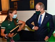 29 October 2021; The athletes and staff who represented Team Ireland at Tokyo 2020 this summer were formally congratulated at the Official Team Ireland Homecoming in Dublin Castle. A record number of Irish athletes competed at the Summer Olympics in Japan with 116 athletes competing across nineteen sports. An Taoiseach Michéal Martin TD, Minister Catherine Martin TD, Minister of State Jack Chambers TD and His Excellency Ambassador Extraordinary and Plenipotentiary of Japan to Ireland, Mr Mitsuru Kitano attended the event to honour the athletes. Pictured is An Taoiseach Micheál Martin TD with Team Ireland Olympian Margaret Cremen. Photo by Sam Barnes/Sportsfile