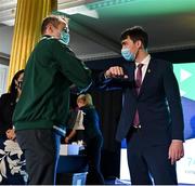 29 October 2021; The athletes and staff who represented Team Ireland at Tokyo 2020 this summer were formally congratulated at the Official Team Ireland Homecoming in Dublin Castle. A record number of Irish athletes competed at the Summer Olympics in Japan with 116 athletes competing across nineteen sports. An Taoiseach Michéal Martin TD, Minister Catherine Martin TD, Minister of State Jack Chambers TD and His Excellency Ambassador Extraordinary and Plenipotentiary of Japan to Ireland, Mr Mitsuru Kitano attended the event to honour the athletes. Making a presentation to Team Ireland athlete Jim O'Donovan is Minister of State for Sport, the Gaeltacht & Defence, Jack Chambers TD.  Photo by Brendan Moran/Sportsfile