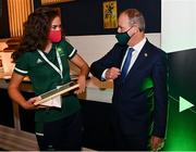 29 October 2021; The athletes and staff who represented Team Ireland at Tokyo 2020 this summer were formally congratulated at the Official Team Ireland Homecoming in Dublin Castle. A record number of Irish athletes competed at the Summer Olympics in Japan with 116 athletes competing across nineteen sports. An Taoiseach Michéal Martin TD, Minister Catherine Martin TD, Minister of State Jack Chambers TD and His Excellency Ambassador Extraordinary and Plenipotentiary of Japan to Ireland, Mr Mitsuru Kitano attended the event to honour the athletes. Pictured is An Taoiseach Micheál Martin TD with Team Ireland Olympian Eimear Lambe. Photo by Sam Barnes/Sportsfile