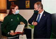 29 October 2021; The athletes and staff who represented Team Ireland at Tokyo 2020 this summer were formally congratulated at the Official Team Ireland Homecoming in Dublin Castle. A record number of Irish athletes competed at the Summer Olympics in Japan with 116 athletes competing across nineteen sports. An Taoiseach Michéal Martin TD, Minister Catherine Martin TD, Minister of State Jack Chambers TD and His Excellency Ambassador Extraordinary and Plenipotentiary of Japan to Ireland, Mr Mitsuru Kitano attended the event to honour the athletes. Pictured is An Taoiseach Micheál Martin TD with Team Ireland Olympian Danielle Hill. Photo by Sam Barnes/Sportsfile