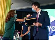 29 October 2021; The athletes and staff who represented Team Ireland at Tokyo 2020 this summer were formally congratulated at the Official Team Ireland Homecoming in Dublin Castle. A record number of Irish athletes competed at the Summer Olympics in Japan with 116 athletes competing across nineteen sports. An Taoiseach Michéal Martin TD, Minister Catherine Martin TD, Minister of State Jack Chambers TD and His Excellency Ambassador Extraordinary and Plenipotentiary of Japan to Ireland, Mr Mitsuru Kitano attended the event to honour the athletes. Making a presentation to Team Ireland athlete Sarah McAuley is Minister of State for Sport, the Gaeltacht & Defence, Jack Chambers TD.  Photo by Brendan Moran/Sportsfile
