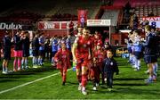 29 October 2021; Shelbourne captain Luke Byrne leads out his team as UCD players provide a guard of honour before the SSE Airtricity League First Division match between Shelbourne and UCD at Tolka Park in Dublin. Photo by Seb Daly/Sportsfile