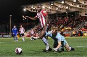 29 October 2021; James Akintunde of Derry City is tackled by Bohemians goalkeeper James Talbot during the SSE Airtricity League Premier Division match between Derry City and Bohemians at Ryan McBride Brandywell Stadium in Derry. Photo by Ramsey Cardy/Sportsfile