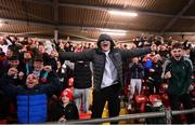 29 October 2021; Derry City supporters celebrate their side's first goal during the SSE Airtricity League Premier Division match between Derry City and Bohemians at Ryan McBride Brandywell Stadium in Derry. Photo by Ramsey Cardy/Sportsfile
