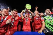 29 October 2021; Luke Byrne of Shelbourne lifts the SSE Airtricity League First Division Trophy and celebrates with team-mates after the SSE Airtricity League First Division match between Shelbourne and UCD at Tolka Park in Dublin. Photo by Seb Daly/Sportsfile