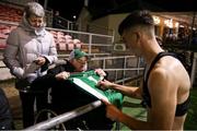 29 October 2021; Barry Coffey of Cork City signs his jersey before presenting it to supporter Gary McSweeney after the SSE Airtricity League First Division match between Cork City and Galway United at Turners Cross in Cork. Photo by Michael P Ryan/Sportsfile