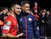 29 October 2021; Ryan Brennan of Shelbourne is presented with his Players' Player award by manager Ian Morris after the SSE Airtricity League First Division match between Shelbourne and UCD at Tolka Park in Dublin. Photo by Seb Daly/Sportsfile