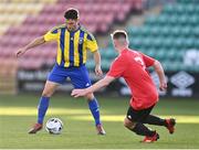 30 October 2021; Shane Duggan of Fairview Rangers in action against Conal Maguire of Willowbank FC during the President's junior cup final match between Fairview Rangers and Willowbank FC at Tallaght Stadium in Dublin. Photo by Piaras Ó Mídheach/Sportsfile