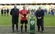 30 October 2021; Man of the match Eamon Hughes of Willowbank with his award alongside IFA president Conrad Kirkwood, left, and FAI president Gerry McAnaney after the President's junior cup final match between Fairview Rangers and Willowbank FC at Tallaght Stadium in Dublin. Photo by Piaras Ó Mídheach/Sportsfile