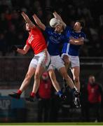30 October 2021; Richard Donnelly of Trillick in action against Ronan McNabb, centre, and Ciaran McCoy of Dromore during the Tyrone County Senior Football Championship Semi-Final match between Dromore and Trillick at Healy Park in Omagh, Tyrone. Photo by Ramsey Cardy/Sportsfile