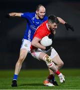 30 October 2021; Matthew Donnelly of Trillick in action against Ronan McNabb of Dromore during the Tyrone County Senior Football Championship Semi-Final match between Dromore and Trillick at Healy Park in Omagh, Tyrone. Photo by Ramsey Cardy/Sportsfile