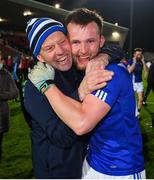 30 October 2021; Cahir Goodwin of Dromore is congratulated by a supporter after the Tyrone County Senior Football Championship Semi-Final match between Dromore and Trillick at Healy Park in Omagh, Tyrone. Photo by Ramsey Cardy/Sportsfile