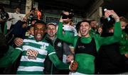 29 October 2021; Shamrock Rovers players, from left, Aidomo Emakhu, Max Murphy and Danny Mandroiu celebrate with their supporters after winning the SSE Airtricity League Premier Division following the match between Shamrock Rovers and Finn Harps at Tallaght Stadium in Dublin. Photo by Stephen McCarthy/Sportsfile