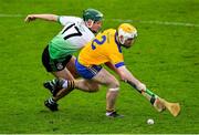31 October 2021; Kevin Burke of Na Fianna is tackled by Charlie Keher of Lucan Sarsfields during the Go Ahead Dublin County Senior Club Hurling Championship Semi-Final match between Lucan Sarsfields and Na Fianna at Parnell Park in Dublin. Photo by Ray McManus/Sportsfile