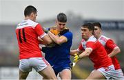 31 October 2021; Cian McManus of Clann na nGael in action against Niall Carty, left, and David Murray of Pádraig Pearses during the Roscommon County Senior Club Football Championship Final match between Clann na nGael and Padraig Pearses at Dr Hyde Park in Roscommon. Photo by Seb Daly/Sportsfile