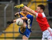 31 October 2021; Ciaran Lennon of Clann na nGael is charged down by Niall Daly of Pádraig Pearses during the Roscommon County Senior Club Football Championship Final match between Clann na nGael and Padraig Pearses at Dr Hyde Park in Roscommon. Photo by Seb Daly/Sportsfile