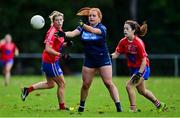 31 October 2021; Claire Gannon of St Jude's in action against Caroline Roban, left, and Grace Smyth of Clontarf B during the Dublin LGFA Go-Ahead Junior Club Football Championship Final match between Clontarf B and St Judes at St Margarets GAA club in Dublin. Photo by Brendan Moran/Sportsfile