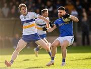 31 October 2021; Padraig Hampsey of Coalisland is tackled by Padraig McGirr of Errigal Ciaran during the Tyrone County Senior Football Championship Semi-Final match between Errigal Ciaran and Coalisland at Pomeroy Plunkett's GAA Club in Tyrone. Photo by Ramsey Cardy/Sportsfile