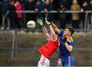31 October 2021; Fearghal Lennon of Clann na nGael in action against Paul Carey of Pádraig Pearses during the Roscommon County Senior Club Football Championship Final match between Clann na nGael and Padraig Pearses at Dr Hyde Park in Roscommon. Photo by Seb Daly/Sportsfile