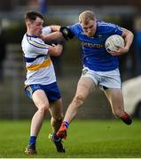 31 October 2021; Peter Herron of Coalisland in action against Cathal Corrigan of Errigal Ciaran during the Tyrone County Senior Football Championship Semi-Final match between Errigal Ciaran and Coalisland at Pomeroy Plunkett's GAA Club in Tyrone. Photo by Ramsey Cardy/Sportsfile