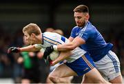 31 October 2021; Ben McDonnell of Errigal Ciaran is tackled by Padraig Hampsey of Coalisland during the Tyrone County Senior Football Championship Semi-Final match between Errigal Ciaran and Coalisland at Pomeroy Plunkett's GAA Club in Tyrone. Photo by Ramsey Cardy/Sportsfile