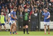 31 October 2021; Michael McKernan of Coalisland receives a red card from referee Kieran Eannetta during the Tyrone County Senior Football Championship Semi-Final match between Errigal Ciaran and Coalisland at Pomeroy Plunkett's GAA Club in Tyrone. Photo by Ramsey Cardy/Sportsfile