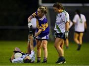 31 October 2021; Lisa Murphy of St Sylvesters is helped by Denise Convery of Castleknock after suffering from cramp during the Dublin LGFA Go-Ahead Intermediate Club Football Championship Final match between St Sylvesters and Castleknock at St Margarets GAA club in Dublin. Photo by Brendan Moran/Sportsfile